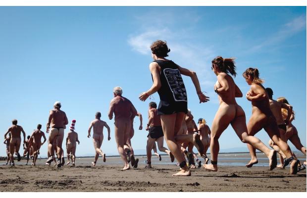 “Runners compete in the Bare Buns Run, a 5 km clothing optional r...